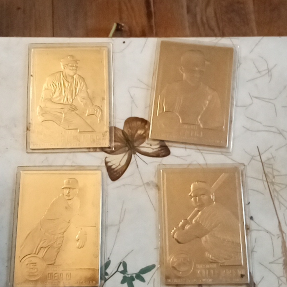 4  22 karat gold baseball cards.